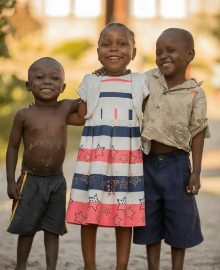 Community members and children gathered together outdoors in Ethiopia